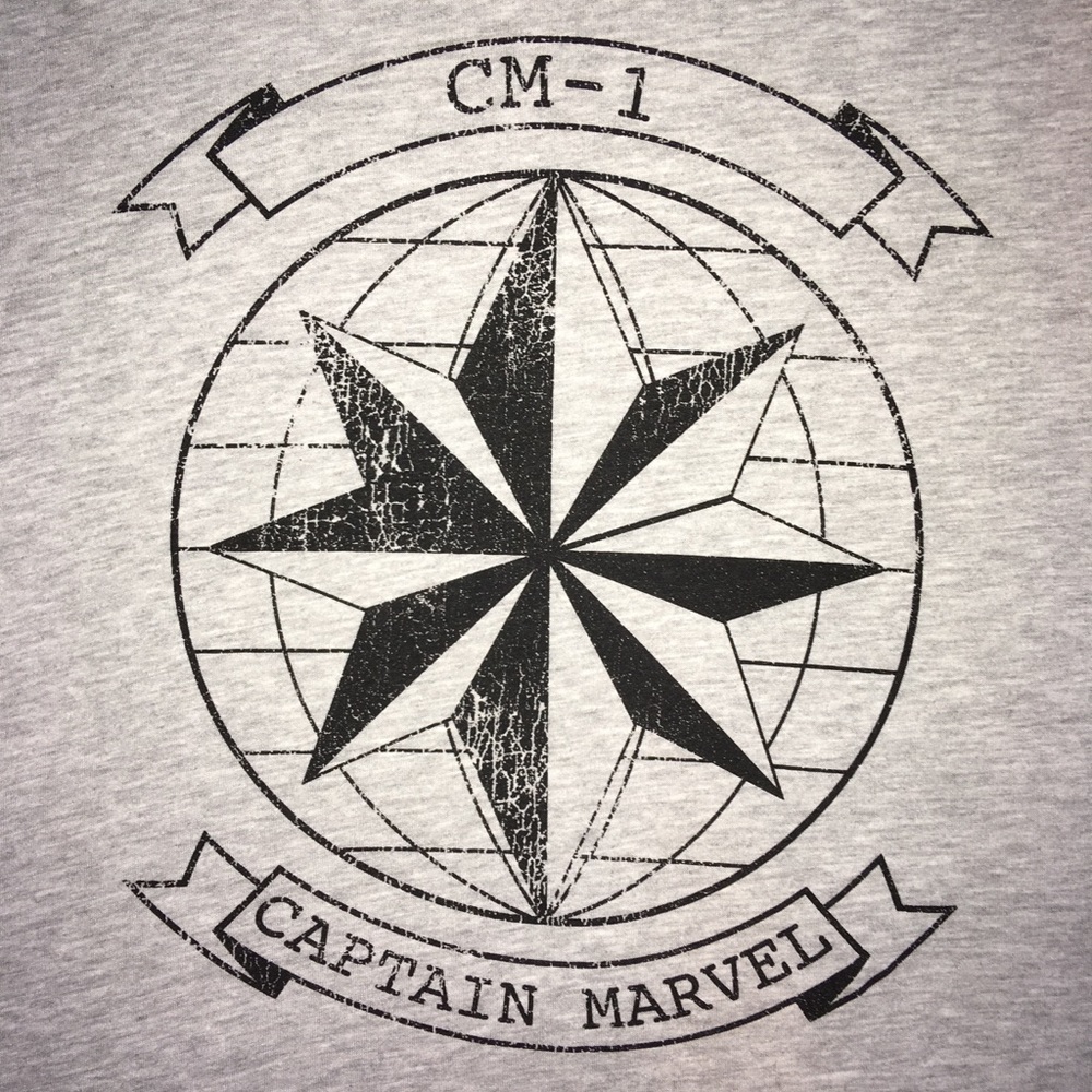 Her universe Cpt. Marvel t-shirt.